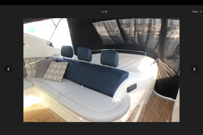 Slide: The Image of Interior seating area of 2006 Azimut Atlantis 55 yacht with cushions and wooden flooring. - 6