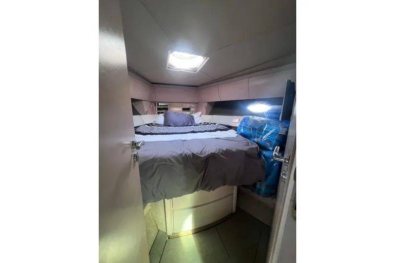 Slide: The Image of Cozy bedroom interior of 2006 Azimut Atlantis 55 yacht with skylight and modern design. - 8