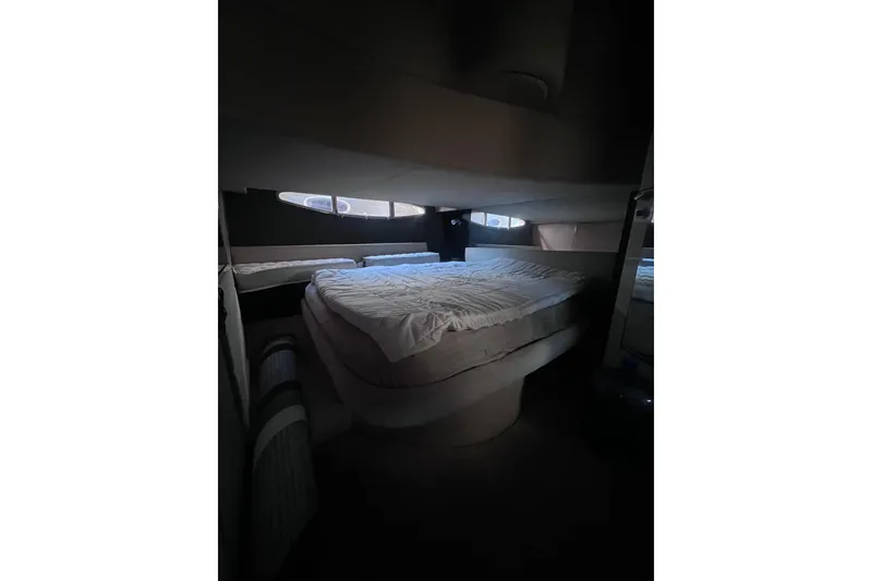 Slide: The Image of Luxurious bedroom interior of 2006 Azimut Atlantis 55 yacht with cozy bedding. - 9