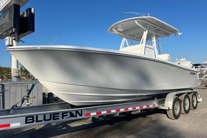 The Image of 2026 Contender 28 Tournament boat on Blue Fin trailer, displayed outdoors. - 1