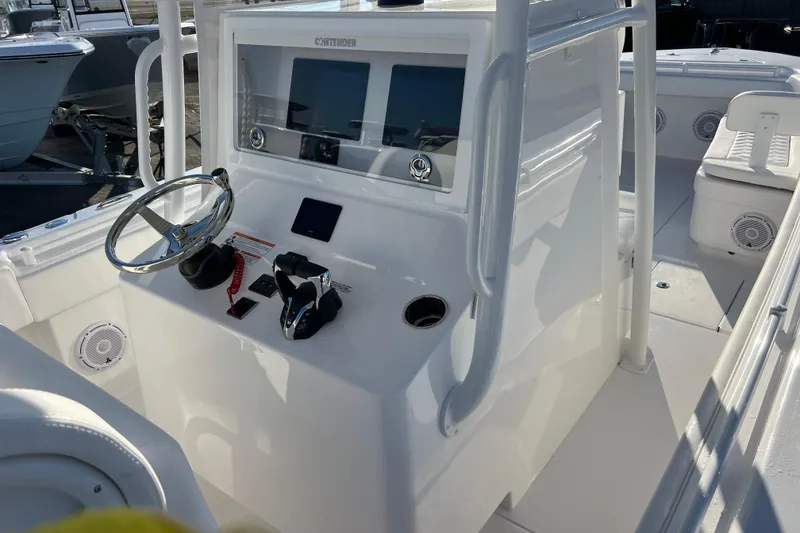 Slide: The Image of 2026 Contender 28 Tournament boat console with steering wheel and controls. - 11
