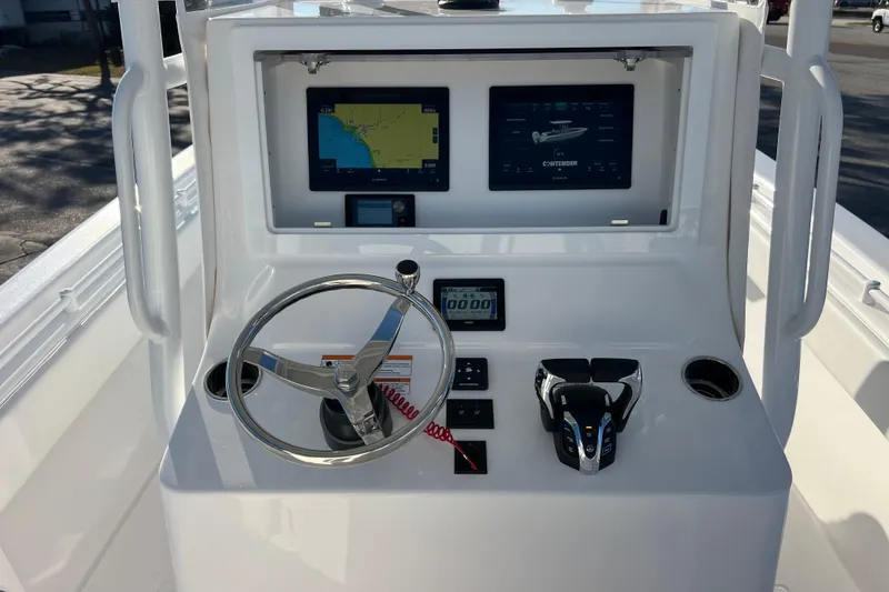 Slide: The Image of Helm of 2026 Contender 28 Tournament boat with navigation screens and controls. - 12