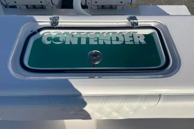 Slide: The Image of Contender 28 Tournament 2026 boat hatch with logo and secure latch. - 19