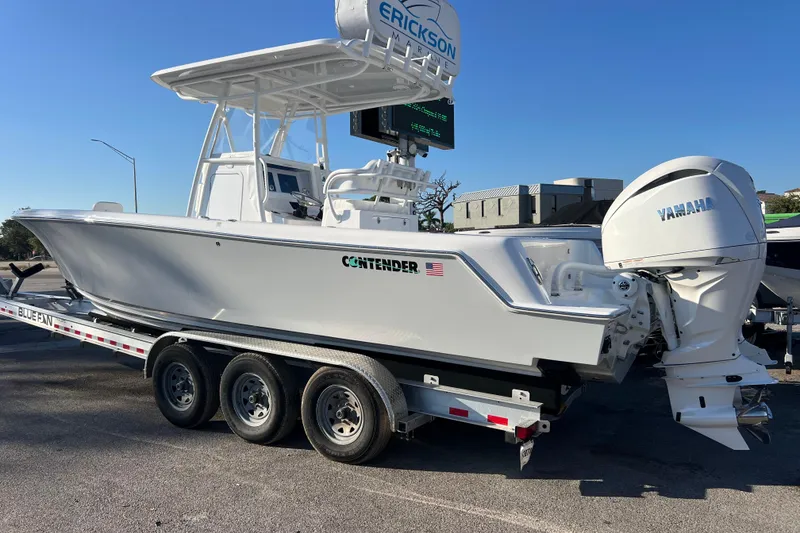 Slide: The Image of 2026 Contender 28 Tournament boat on trailer with Yamaha engine, parked outdoors. - 5