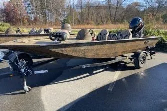 The Image of 2026 G3 Sportsman 1710 PFX fishing boat on trailer in outdoor setting. - 0