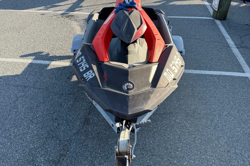 Slide: The Image of 2021 Sea-Doo Spark Trixx 2up jet ski parked on asphalt. - 3