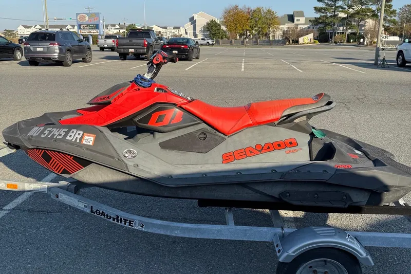 Slide: The Image of 2021 Sea-Doo Spark Trixx 2up jet ski on trailer in parking lot. - 5
