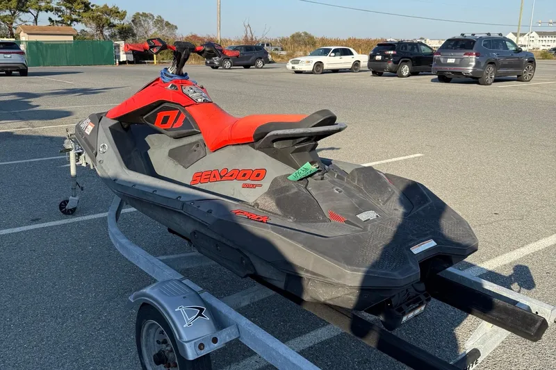 Slide: The Image of 2021 Sea-Doo Spark Trixx 2up jet ski on trailer in parking lot. - 6