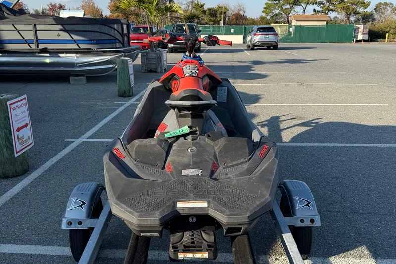 Slide: The Image of 2021 Sea-Doo Spark Trixx 2up jet ski on trailer in parking lot. - 7