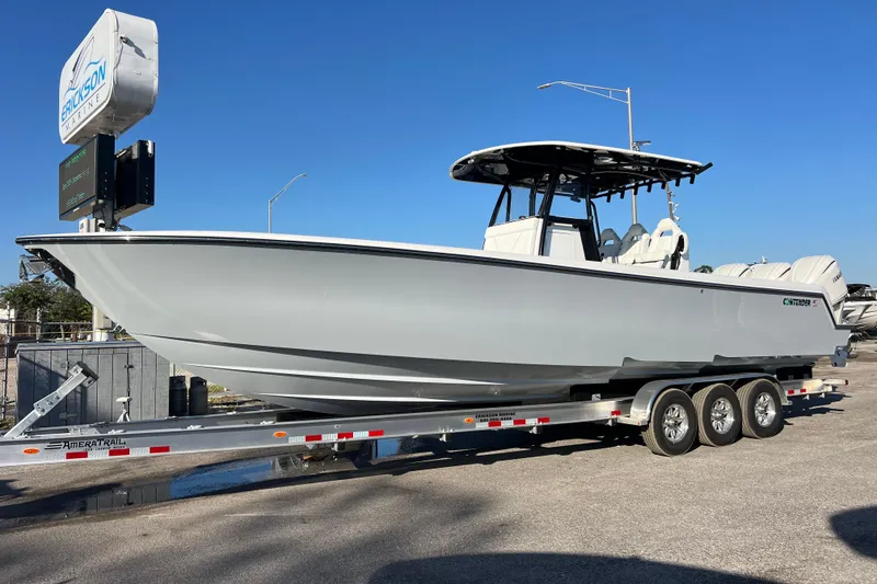 Slide: The Image of 2026 Contender 35 ST boat on trailer at Erickson Marine dealership. - 1