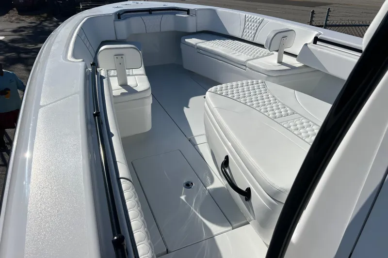 Slide: The Image of 2026 Contender 35 ST boat interior with white cushioned seating and sleek design. - 13