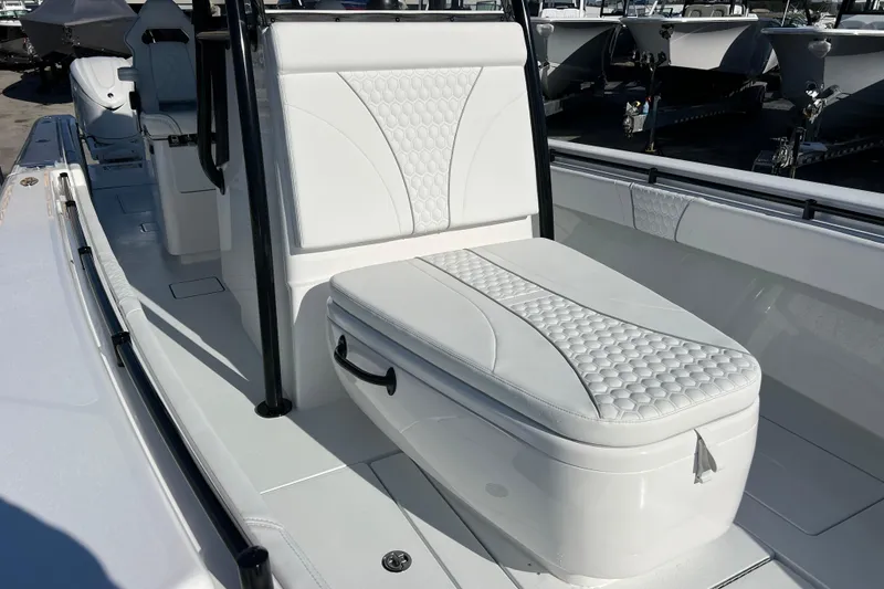 Slide: The Image of 2026 Contender 35 ST boat interior with white cushioned seating and sleek design. - 16