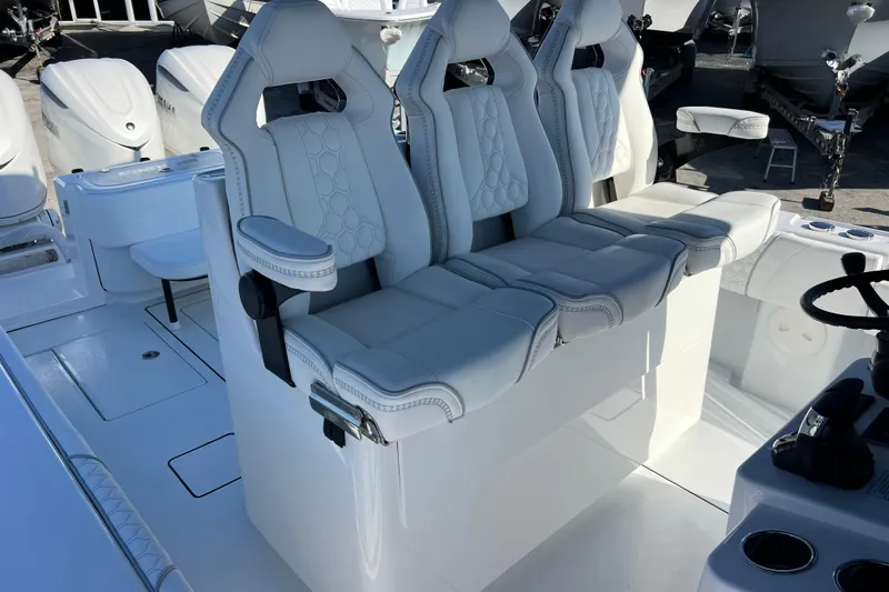 Slide: The Image of 2026 Contender 35 ST boat interior with luxurious white seating and modern design. - 17