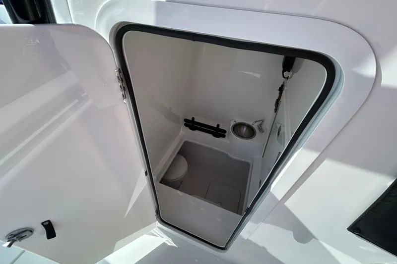 Slide: The Image of 2026 Contender 35 ST boat interior with compact bathroom and sink. - 20