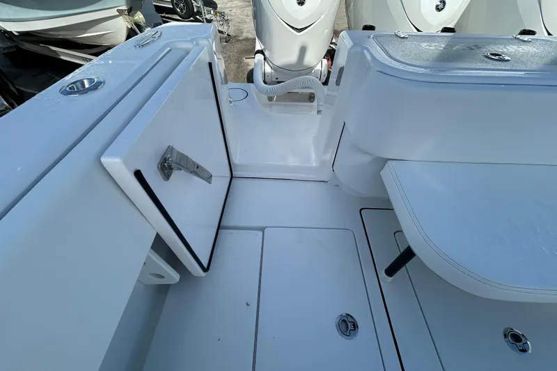 Slide: The Image of 2026 Contender 35 ST boat interior with storage compartments and seating area. - 24