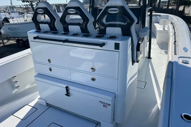 Slide: The Image of 2026 Contender 35 ST boat interior with seating and storage compartments. - 7