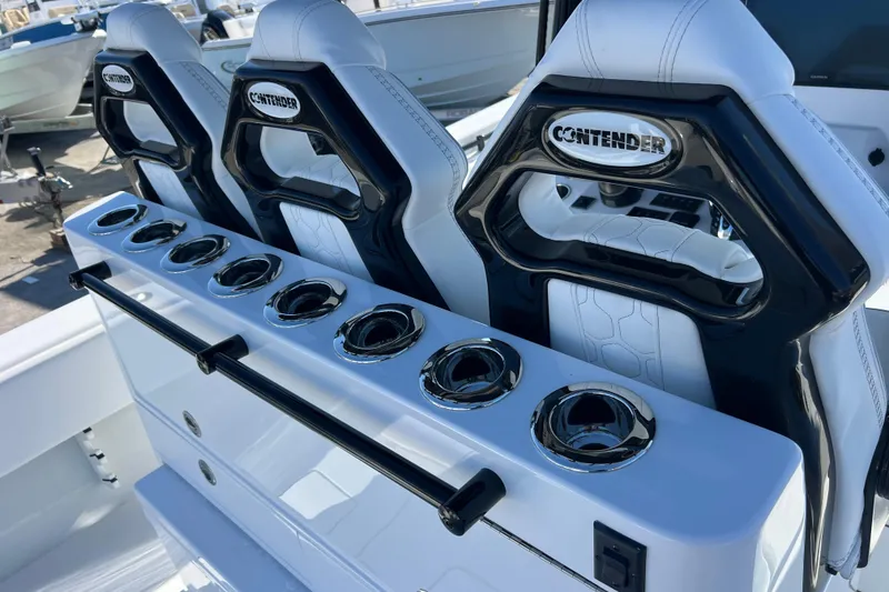 Slide: The Image of 2026 Contender 35 ST boat seats with integrated cup holders and sleek design. - 9