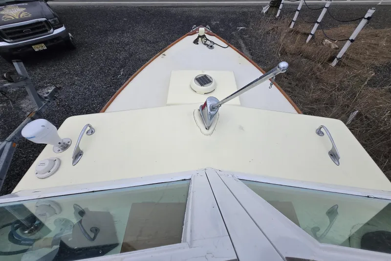 Slide: The Image of 1964 Whiticar 24 boat deck with chrome fittings and windshield, viewed from above. - 21