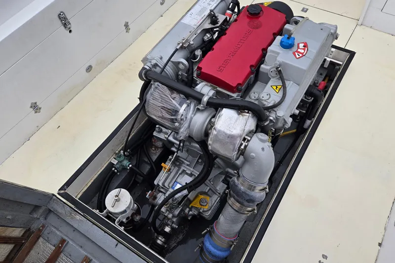 Slide: The Image of Engine compartment of a 1964 Whiticar 24 boat, showcasing a modern diesel engine. - 3