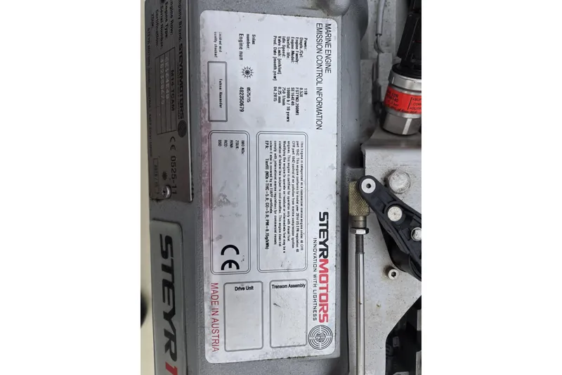 Slide: The Image of 1964 Whiticar 24 marine engine with Steyr Motors emission control information label. - 30