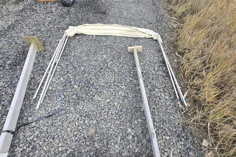 Slide: The Image of Disassembled frame and fabric on gravel, possibly for a 1964 Whiticar 24 boat. - 34