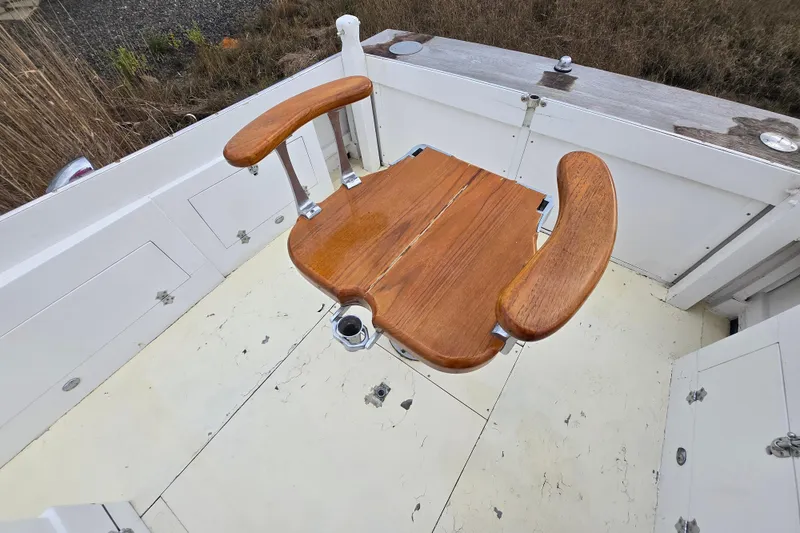 Slide: The Image of Vintage 1964 Whiticar 24 boat with wooden fishing chair on deck. - 7