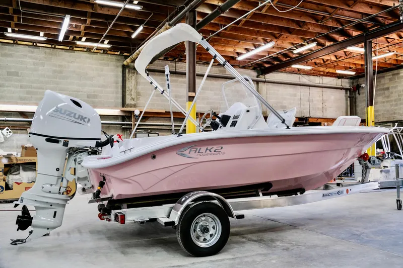 The Image of 2026 ALK2 Powerboats 18 CRS in a warehouse, featuring a Suzuki outboard motor. - 0