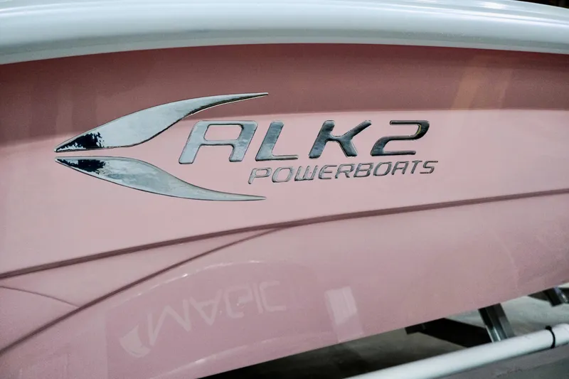 Slide: The Image of 2026 ALK2 Powerboats 18 CRS, pink hull with logo detail. - 10