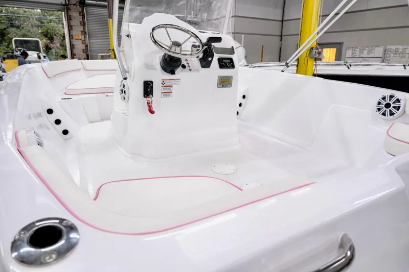 Slide: The Image of 2026 ALK2 Powerboats 18 CRS interior with steering console and seating. - 11