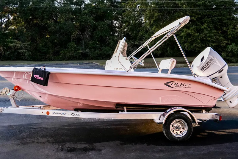 Slide: The Image of 2026 ALK2 Powerboats 18 CRS in pink on trailer, featuring Suzuki outboard motor. - 13