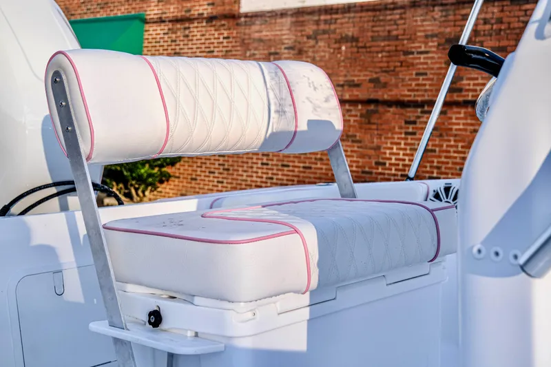 Slide: The Image of 2026 ALK2 Powerboats 18 CRS, featuring white cushioned seating with pink accents. - 20