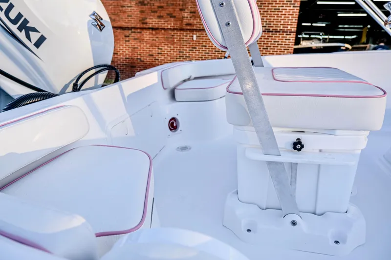 Slide: The Image of 2026 ALK2 Powerboats 18 CRS interior with white seating and Suzuki engine. - 21
