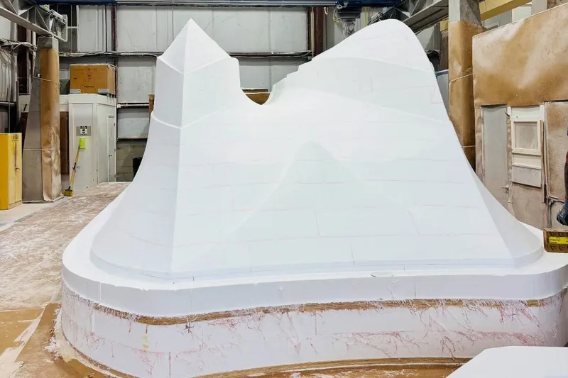 Slide: The Image of Mold for 2026 Front Runner 34 Catamaran in a workshop setting. - 10