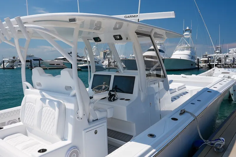 Slide: The Image of 2026 Front Runner 35 Catamaran docked, showcasing sleek design and advanced navigation equipment. - 15