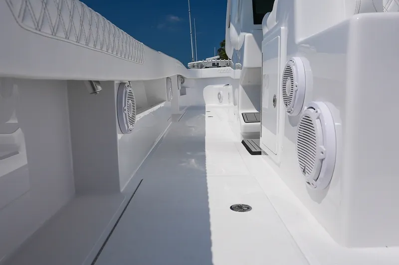 Slide: The Image of 2026 Front Runner 35 Catamaran deck with speakers and sleek white design. - 14