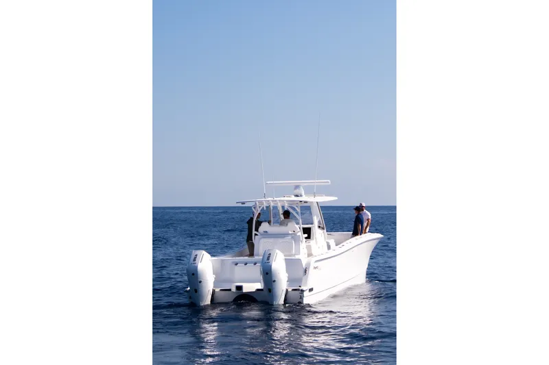Slide: The Image of 2026 Front Runner 35 Catamaran cruising on open sea with clear blue sky. - 18