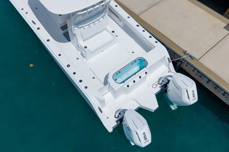 Slide: The Image of Aerial view of 2026 Front Runner 35 Catamaran docked, featuring dual outboard engines. - 6