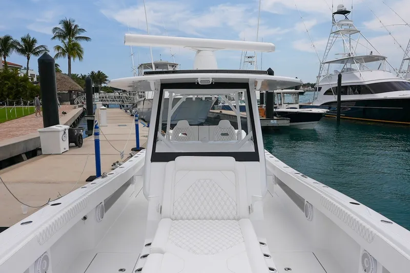 Slide: The Image of 2026 Front Runner 35 Catamaran docked at marina, showcasing sleek design and spacious deck. - 10