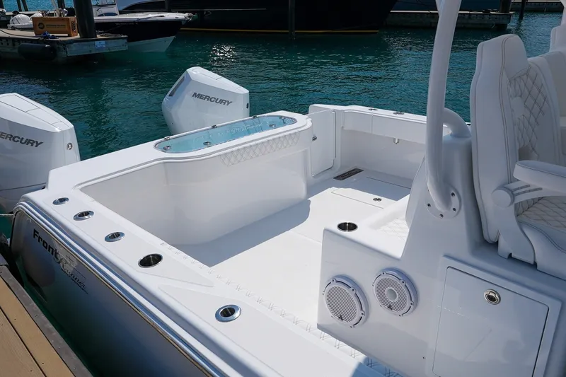 Slide: The Image of 2026 Front Runner 35 Catamaran with Mercury engines, featuring spacious deck and luxurious seating. - 8