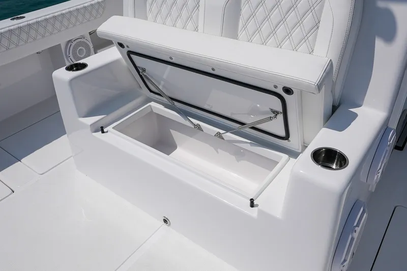 Slide: The Image of Luxurious seating with storage on 2026 Front Runner 35 Catamaran, featuring cup holders and speakers. - 17