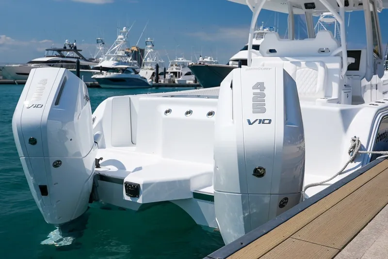 Slide: The Image of 2026 Front Runner 35 Catamaran with twin Mercury 425 V10 engines docked in marina. - 4