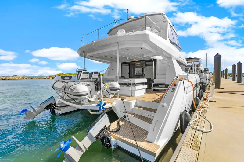 Slide: The Image of 2024 Leopard 46 Powercat docked, showcasing sleek design and modern features. - 10