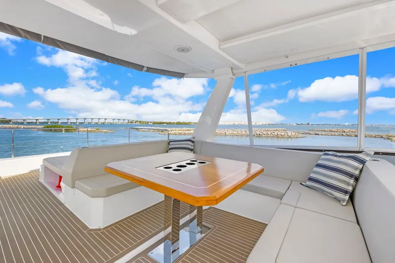 Slide: The Image of Luxurious 2024 Leopard 46 Powercat yacht interior with ocean view and comfortable seating. - 24