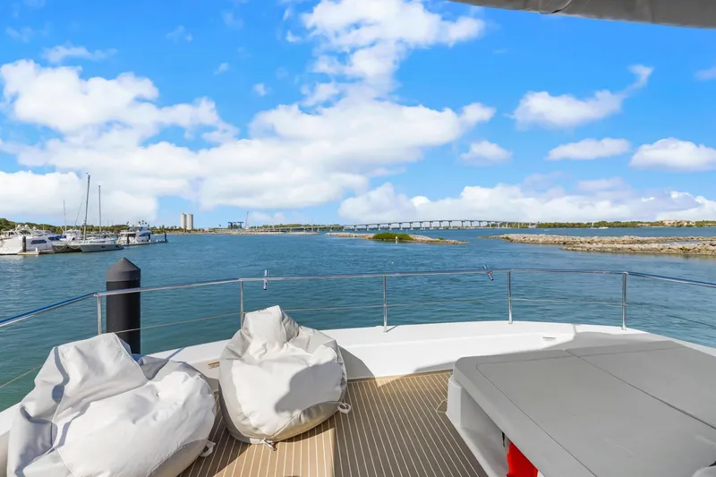 Slide: The Image of 2024 Leopard 46 Powercat deck view with ocean and bridge in background. - 33