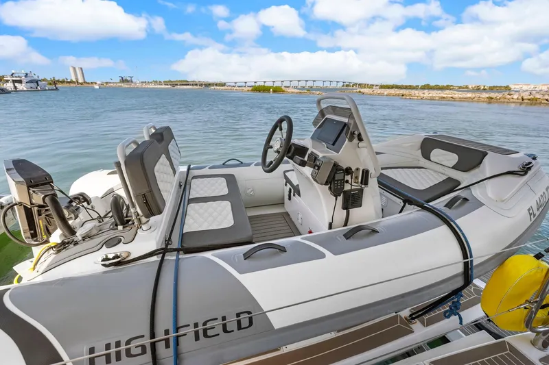 Slide: The Image of 2024 Leopard 46 Powercat with modern helm, docked by scenic waterfront. - 36