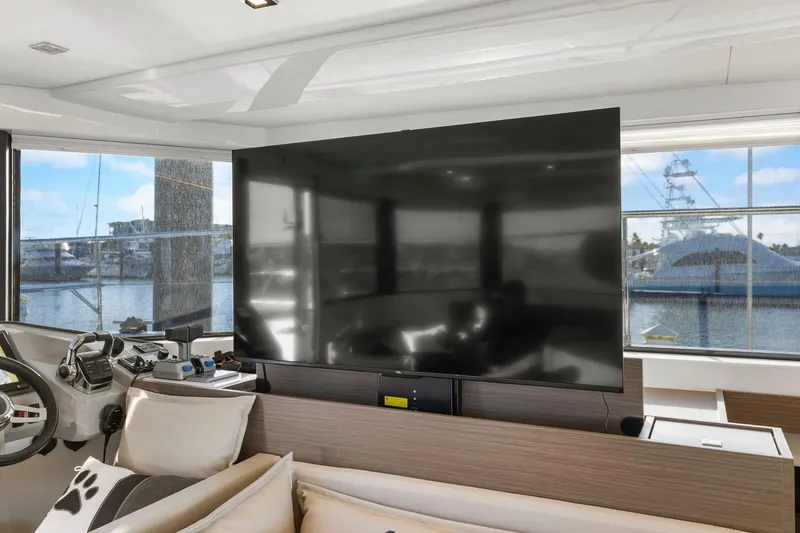 Slide: The Image of Interior of 2024 Leopard 46 Powercat yacht with large TV and marina view. - 51