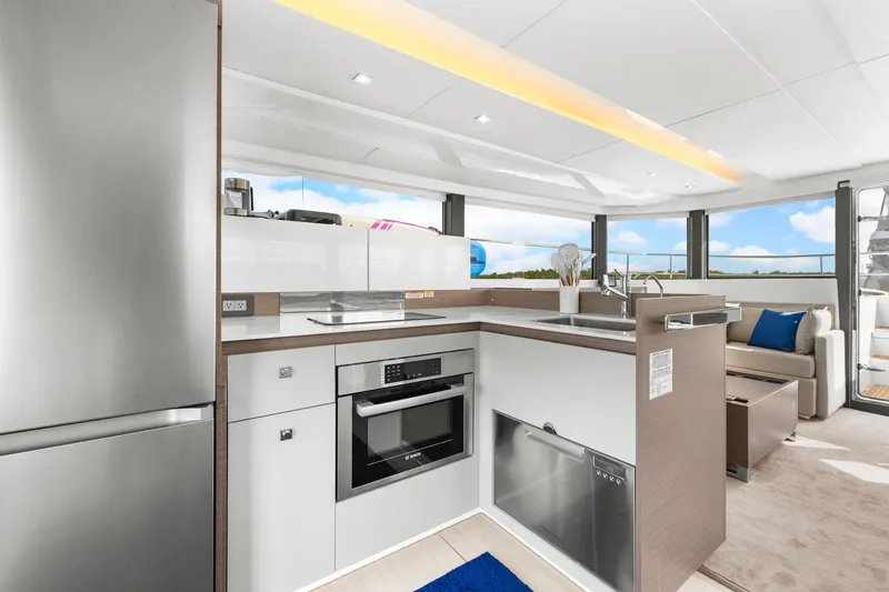 Slide: The Image of Modern kitchen interior on 2024 Leopard 46 Powercat yacht with sleek appliances and panoramic windows. - 54