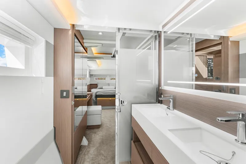 Slide: The Image of Luxurious interior of 2024 Leopard 46 Powercat yacht featuring modern bathroom and bedroom. - 58