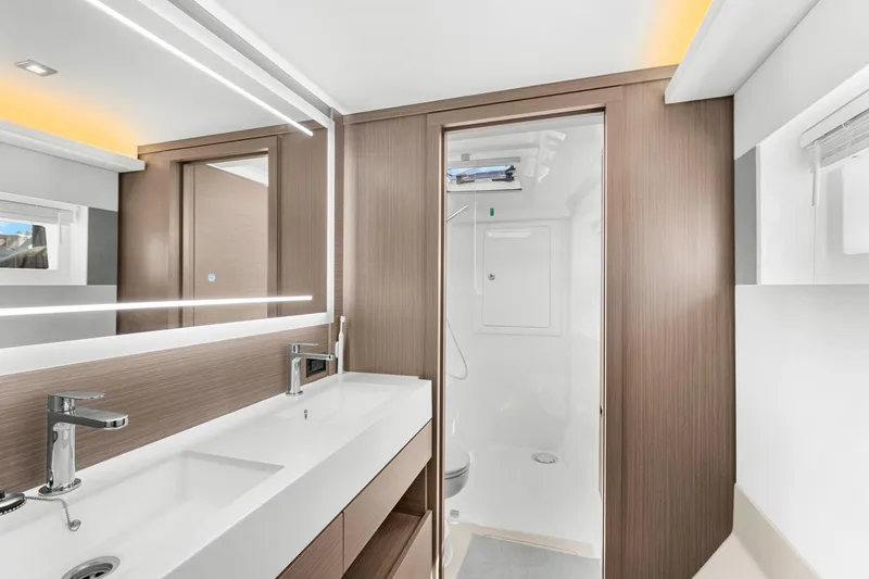 Slide: The Image of Modern bathroom interior of 2024 Leopard 46 Powercat yacht, featuring sleek design and dual sinks. - 59