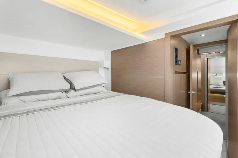 Slide: The Image of Luxurious bedroom interior of 2024 Leopard 46 Powercat yacht, featuring modern design and cozy bedding. - 65